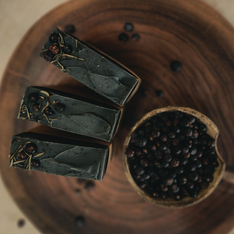 The Woodsman handmade cold process whiskey soap with activated charcoal, cedarwood, patchouli, juniper berries and raw honey by Wild Folk Soap Co.