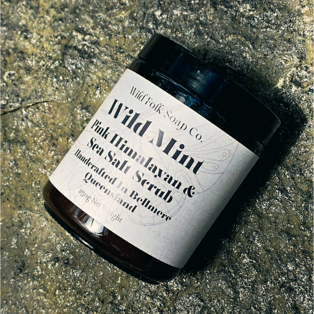 Jar of Wild Mint Sea Salt Scrub from Wild Folk Soap Co. on a textured surface