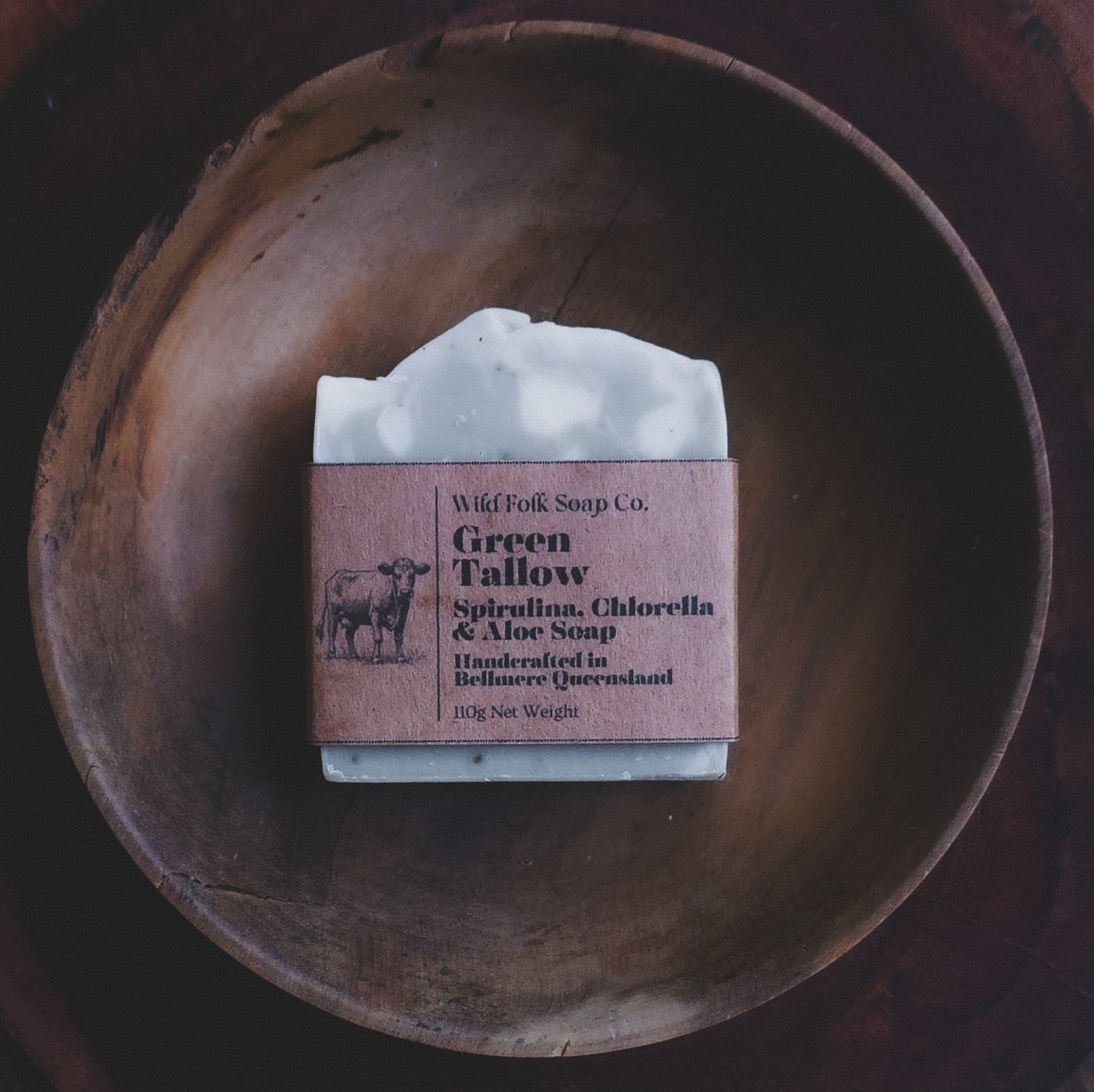 Green Tallow handmade cold process tallow soap made with Australian grass-fed beef tallow, aloe vera, green clay and pure essential oils on a rustic wooden surface by Wild Folk Soap Co.