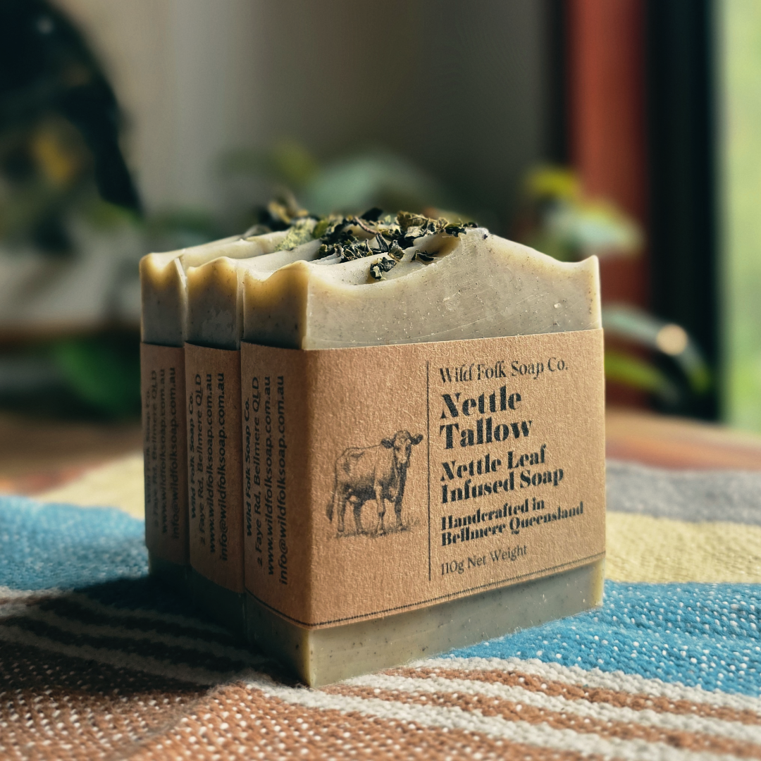 Bar of soap with a brown label on a textured surface