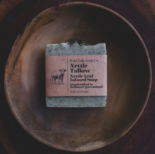 Nettle Tallow handmade cold process tallow soap made with Australian grass-fed beef tallow, nettle and pure essential oils on a rustic wooden surface by Wild Folk Soap Co.
