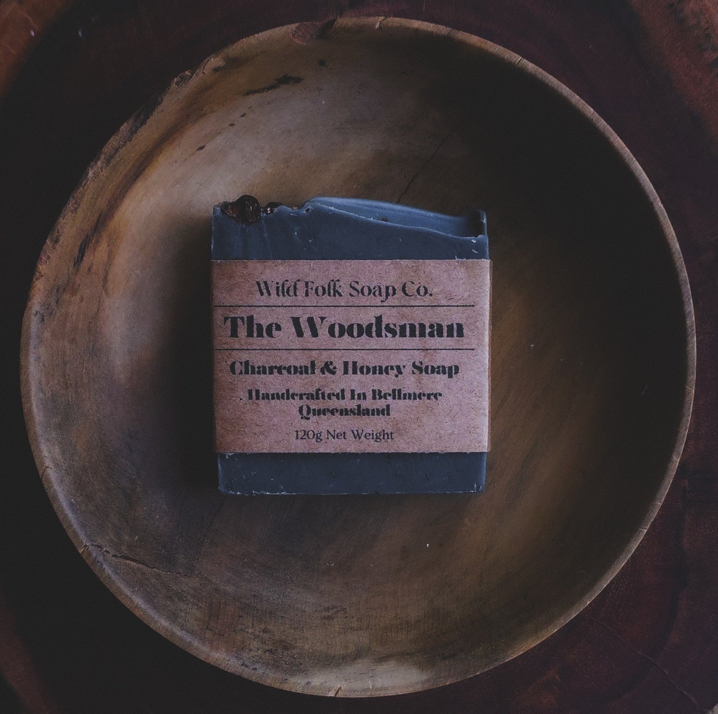 The Woodsman handmade cold process whiskey soap with activated charcoal, cedarwood, patchouli, juniper berries and raw honey by Wild Folk Soap Co.