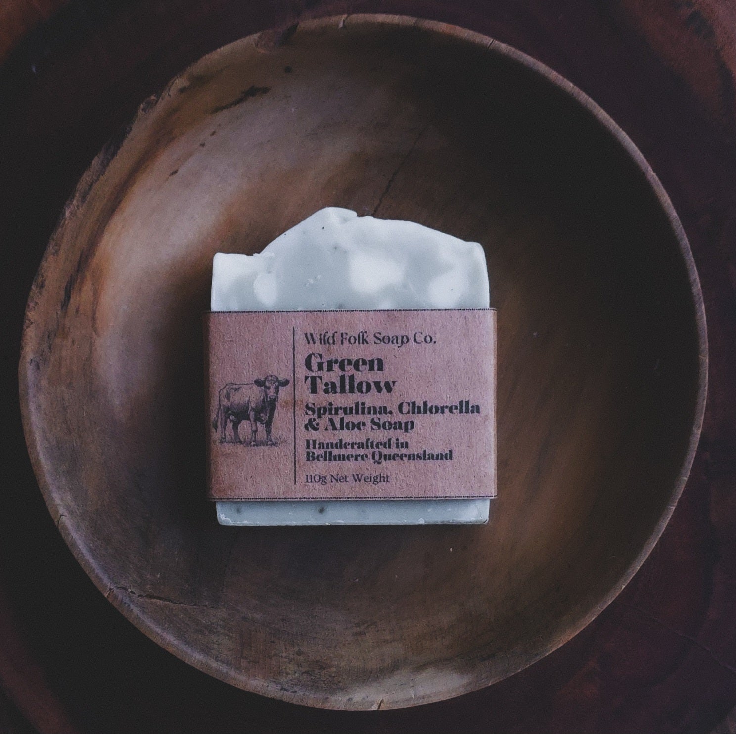 Green Tallow handmade cold process tallow soap made with Australian grass-fed beef tallow, aloe vera, green clay and pure essential oils on a rustic wooden surface by Wild Folk Soap Co.